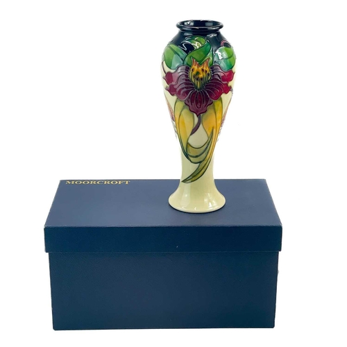 595 - A Moorcroft Pottery inverted baluster vase. Anna Lily pattern with box, height 27cm.