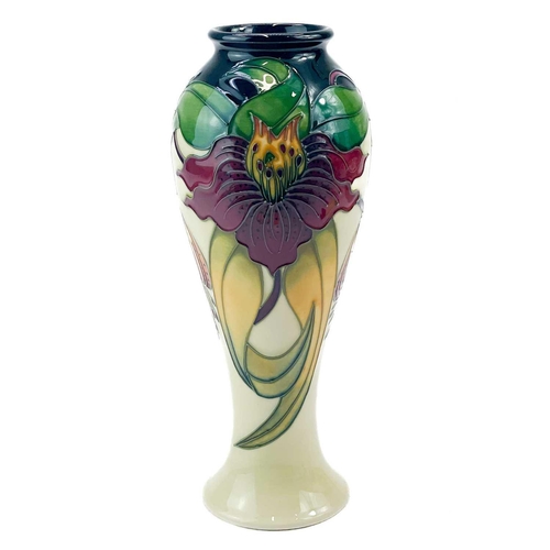 595 - A Moorcroft Pottery inverted baluster vase. Anna Lily pattern with box, height 27cm.