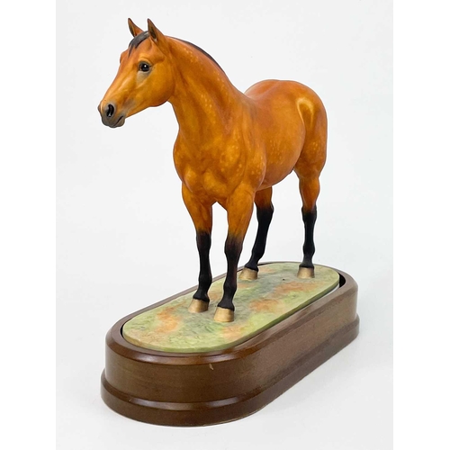 597 - A Royal Worcester porcelain Quarter Horse. With stand and certificate, height 24cm No condition issu... 