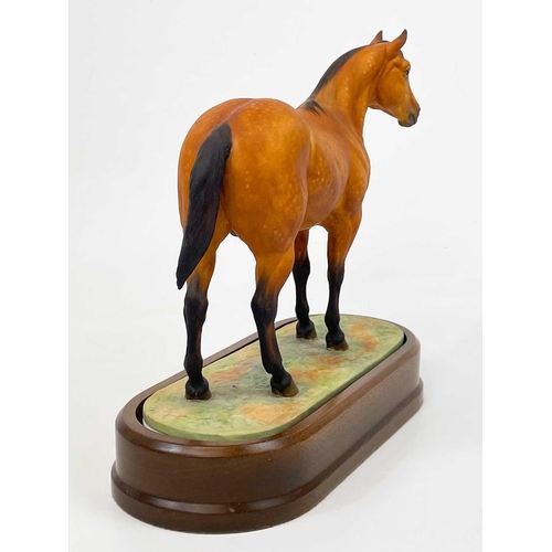 597 - A Royal Worcester porcelain Quarter Horse. With stand and certificate, height 24cm No condition issu... 