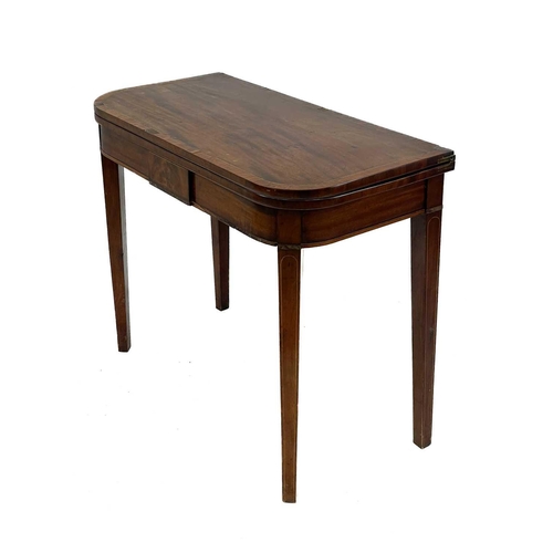 609 - A 19th century mahogany fold over tea table. D-shaped swivel top on tapering square supports, height... 