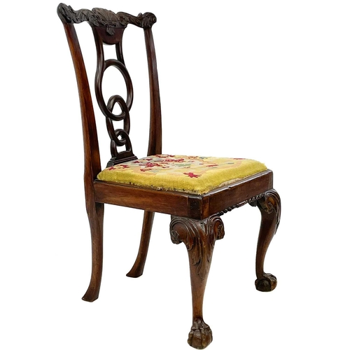 613 - A George III mahogany dining chair. With an unusual circle and oval moulded back, and raised on cabr... 