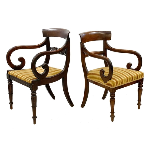 614 - A George IV mahogany carver chair. With a carved rail and raised on turned and fluted front legs, to... 