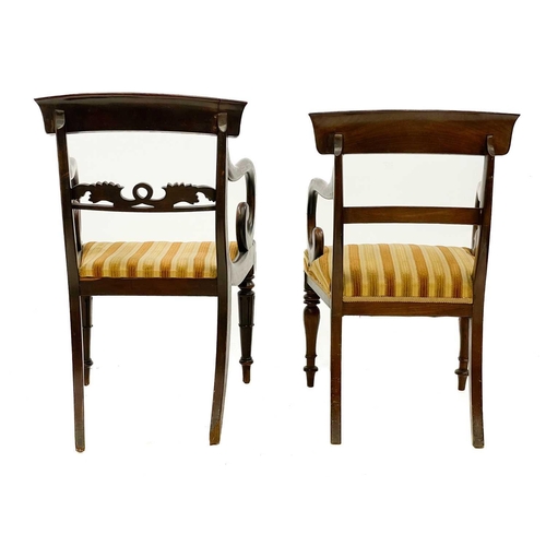 614 - A George IV mahogany carver chair. With a carved rail and raised on turned and fluted front legs, to... 