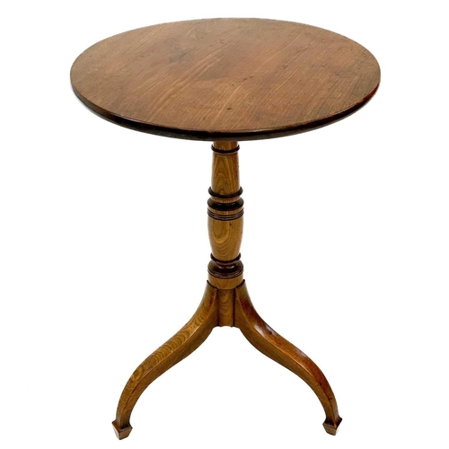 632 - A late George III circular mahogany wine table. Raised on a turned pillar and splay tripod base with... 