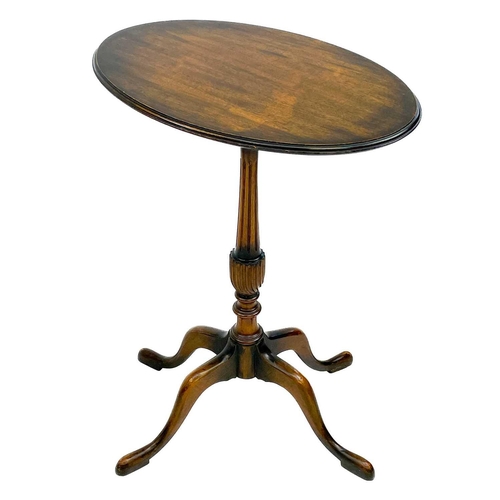 632 - A late George III circular mahogany wine table. Raised on a turned pillar and splay tripod base with... 