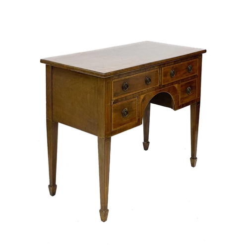 633 - A mahogany and inlaid kneehole side table. Fitted with an arrangement of four drawers, square taper ... 