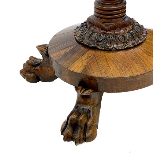 641 - A 19th century carved mahogany and rosewood standard lamp. With leaf carved column, on a circular ba... 