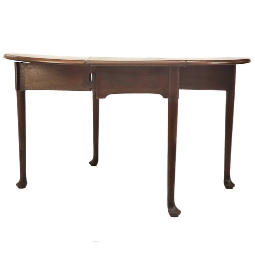 648 - A Georgian mahogany drop leaf table. With club feet, height 74cm extended 134cm depth 126cm