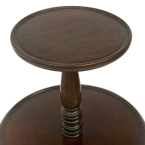 655 - A Regency mahogany three tier circular dumb waiter. With a turned central column on swept tripod sup... 