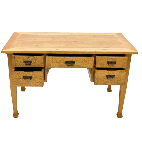 656 - A satin birch and bird's eye maple writing table. Continental, circa 1910, fitted with five kneehole... 