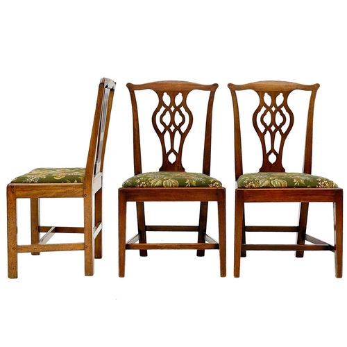 657 - A set of three George III mahogany dining chairs. With pierced splat backs, drop-in seats on square ... 