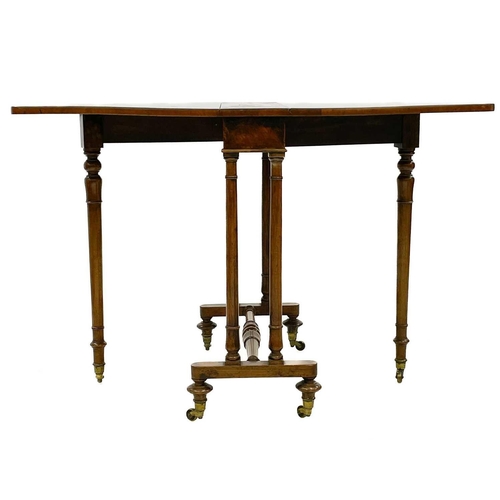 672 - A Victorian figured walnut Sutherland table. With turned supports and stretcher, on brass castors, h... 