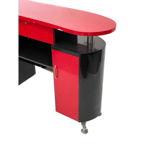 689 - A Dir Janus black and red laminated Barbers or shop cabinet. 1980s, fitted with a drawer and two cup... 