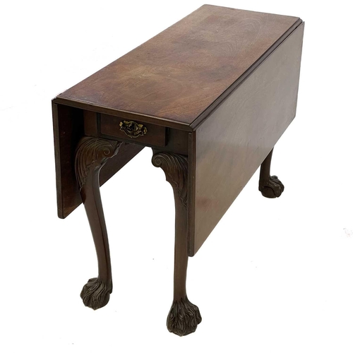 690 - A George II mahogany twin-flap dining table. With substantial figured leaves, fitted a drawer to eac... 