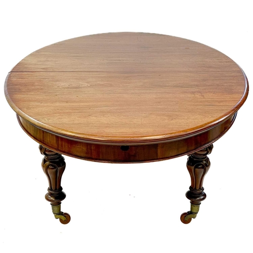 694 - A good early Victorian mahogany oval extending dining table. Fitted with three extra leaves and rais... 