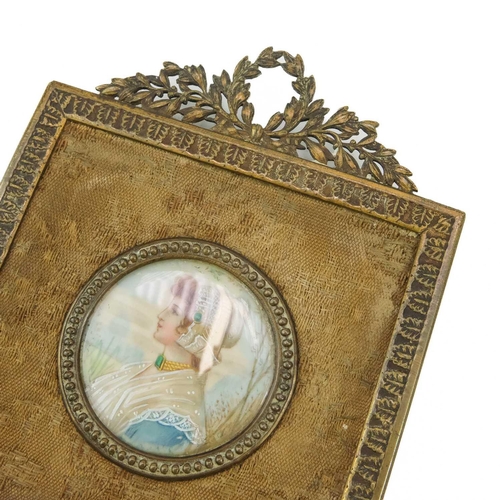 70 - A 19th century miniature portrait. Continental School, of a young maiden, indistinctly signed to the... 