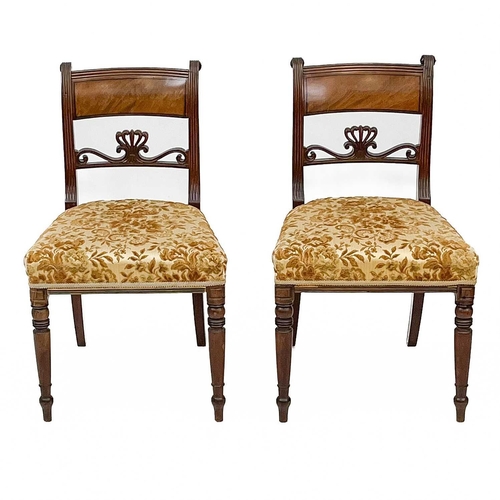 703 - A set of five Regency mahogany dining chairs. With carved mid-rails on sabre front legs, together wi... 