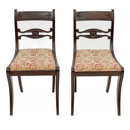 703 - A set of five Regency mahogany dining chairs. With carved mid-rails on sabre front legs, together wi... 