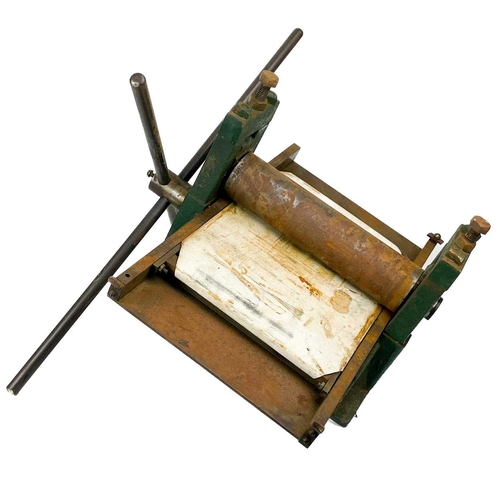 708 - An Adana hand printing press. Together with an 18 drawer painted steel printer's block cabinet, with... 