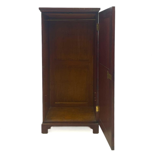 714 - An unusual late Victorian mahogany cupboard or low wardrobe. Fashioned as a tall straight front ches... 