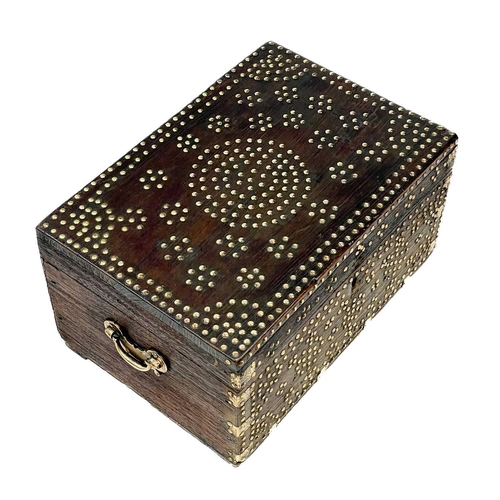 716 - A 19th century Middle Eastern dowry chest. With geometric stud work decoration, height 28cm width 50... 