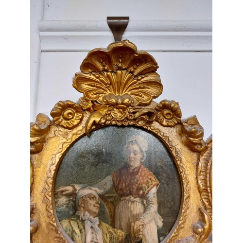 726 - A 19th century continental gilt gesso wall mirror/girandole. The ornate scrolled crest with inset pi... 