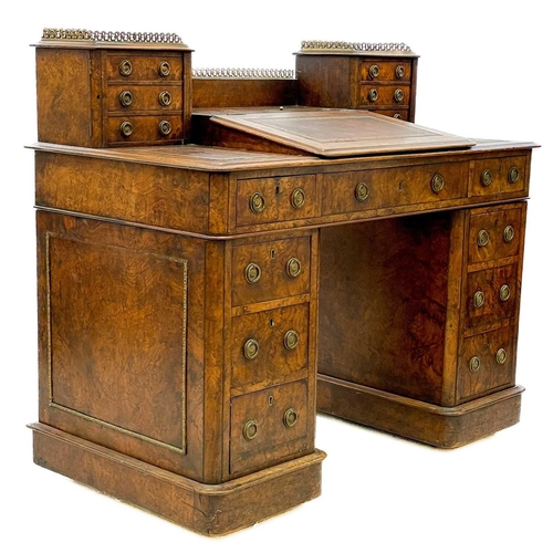 739 - A Victorian burr walnut twin pedestal writing desk. The superstructure with gilt metal gallery and f... 