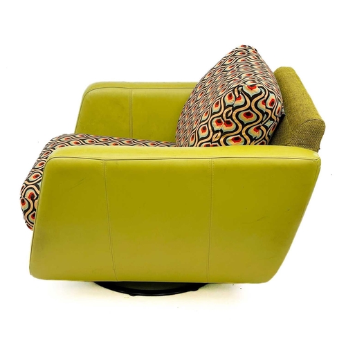 747 - A lime green leatherette and upholstered swivel chair by Rondo. Label to base, height 72cm width 97c... 