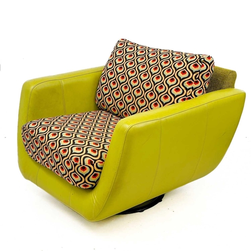 747 - A lime green leatherette and upholstered swivel chair by Rondo. Label to base, height 72cm width 97c... 