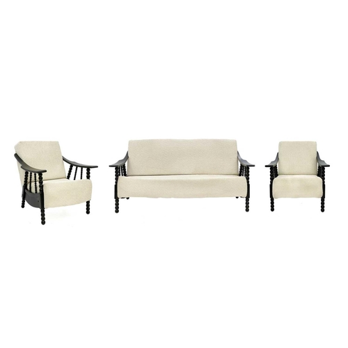 748 - A mid-century black painted and upholstered three-piece suite. With bobbin turned supports and legs,... 