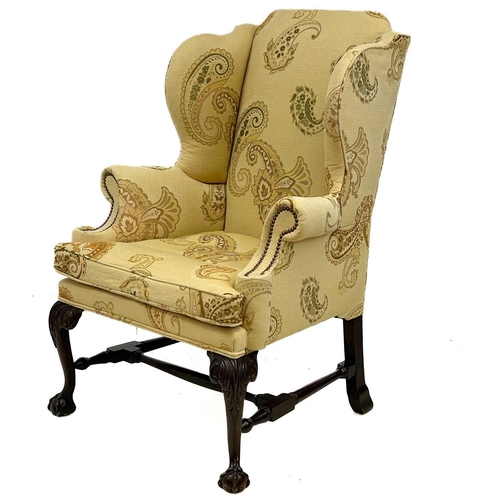 749 - A good George II style walnut carved upholstered wing back armchair. Raised on front cabriole legs c... 