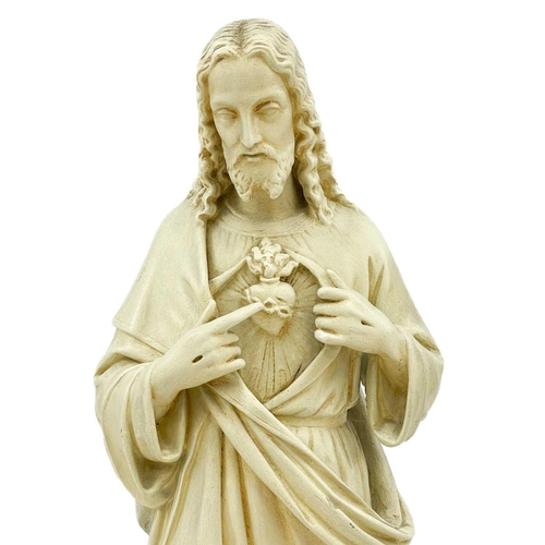 79 - A cast plaster statue of Jesus. Height 86cm.