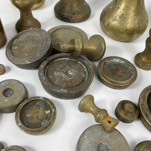 83 - A collection of various brass postal weights. Together with other weights.