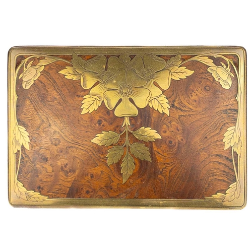 85 - A Continental elm and brass inlaid trinket box. With etched floral and foliate inlaid lid, width 16c... 