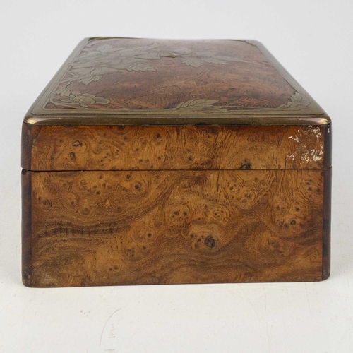 85 - A Continental elm and brass inlaid trinket box. With etched floral and foliate inlaid lid, width 16c... 