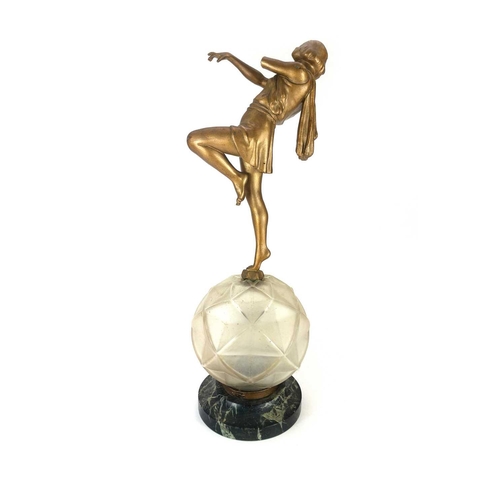 9 - An Art Deco cast spelter figural table lamp. Modelled as a seated female on a marble plinth base, he... 