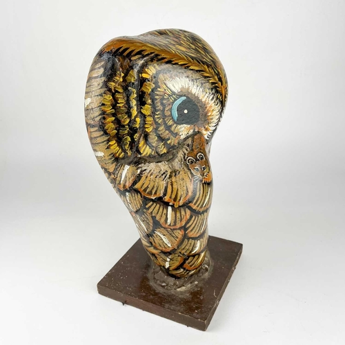 93 - A hand painted owl figure by Jennifer Andrew. A large stone on wooden base, hand painted to depict a... 