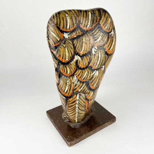 93 - A hand painted owl figure by Jennifer Andrew. A large stone on wooden base, hand painted to depict a... 