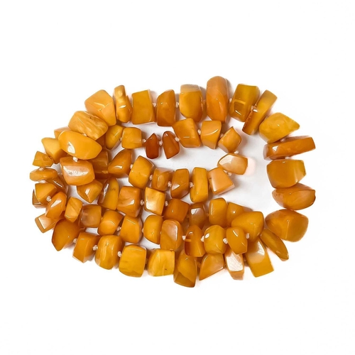 409 - A butterscotch 'amber' irregular beaded necklace. 117.9g. Approximately 38cm in length.