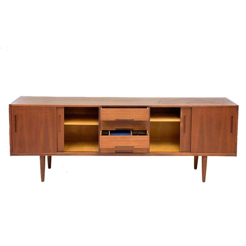 10 - A Nils Jonsson Troeds teak sideboard Fitted a central bank of four drawers, flanked by two cupboards... 