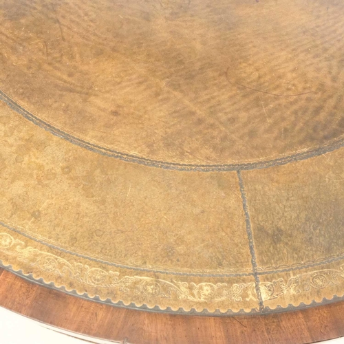 109 - A Regency mahogany circular library table. With inset leather skiver, fitted four real and four dumm... 