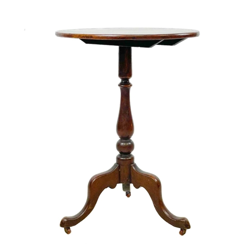 30 - A Victorian oval mahogany wine table. With tilt top, raised on a baluster turned pillar and tripod b... 