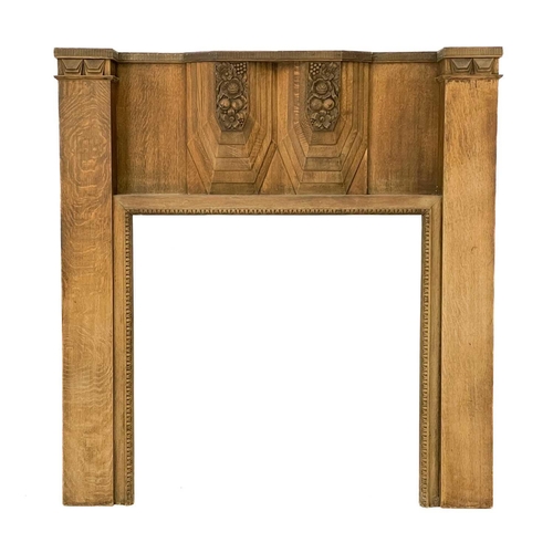 34 - An Art Deco French walnut carved fire surround. Decorated with fruits, flowers and geometric designs... 