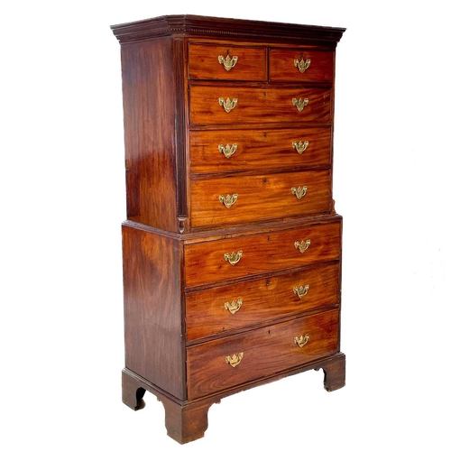 35 - A George III mahogany chest on chest. With a dentil cornice above two short and three long drawers, ... 