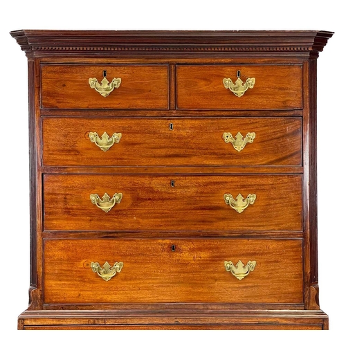 35 - A George III mahogany chest on chest. With a dentil cornice above two short and three long drawers, ... 