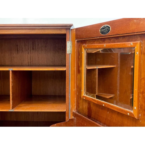 46 - A Gentleman's mahogany Compactum wardrobe. Fitted with two doors, each set twin fielded panels, and ... 