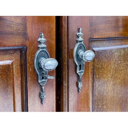 46 - A Gentleman's mahogany Compactum wardrobe. Fitted with two doors, each set twin fielded panels, and ... 