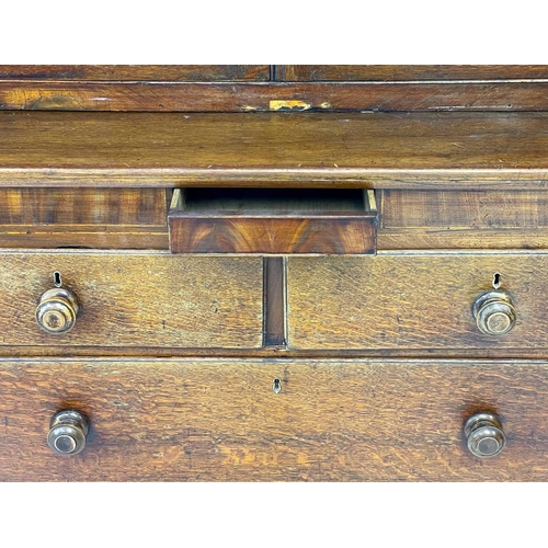 56 - A 19th century oak estate cabinet. The upper with twin cupboard doors enclosing three shelves above ... 