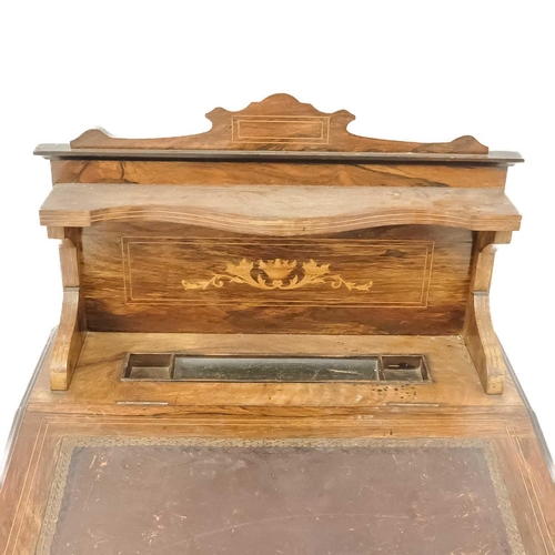 60 - A late Victorian rosewood and inlaid slope top writing desk. With shelved, raised back, on square ta... 